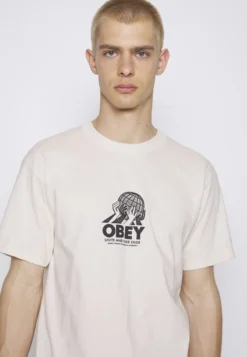 Obey Clothing Unite - Camiseta Estampada - Cream -Fuerza PUMA 0819c45e1340467f80df18f22a9e5fcc scaled