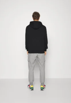 Puma Fundamentals Hoodie - Jersey Con Capucha - Black 8 Puma Fundamentals Hoodie - Jersey Con Capucha - Black -Fuerza PUMA 0dfc43d80aab4a9294d1472049ceb453 scaled