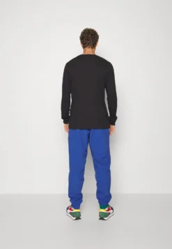 Puma Clyde Pant - Pantalones Deportivos - Blazing Blue/White 7 Puma Clyde Pant - Pantalones Deportivos - Blazing Blue/White -Fuerza PUMA 93a69ee291e54c7885b144778db31f6d scaled